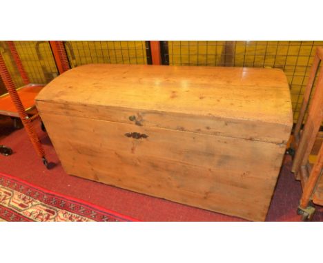 An antique pine dome top trunk with twin handles 