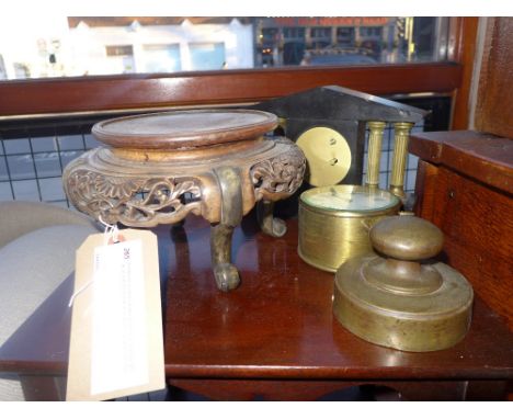 A Chinese carved hardwood stand, a large weight, an architectural slate mounted clock and one other 