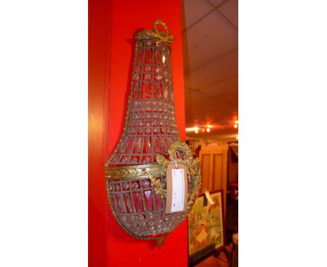 A gilt metal and cut glass basket form wall light