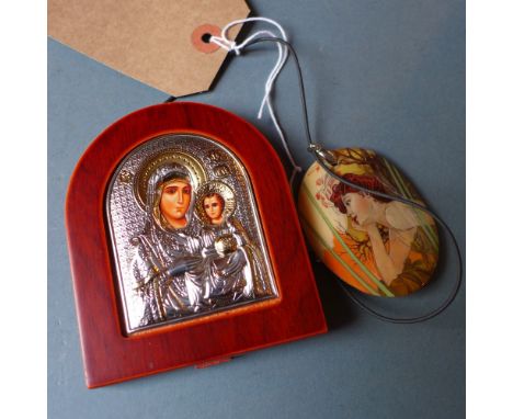 A Russian oval mother of pearl pendant on necklace, hand painted with an art nouveau style maiden