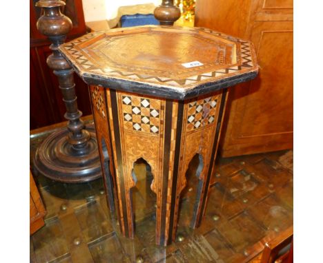 A Liberty style Moorish octagonal occasional table, having Mother of Pearl inlay (af minor veneer loss)