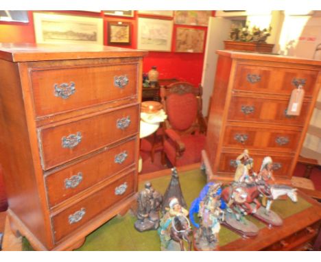 A pair of Georgian style yew wood bedside chests fitted four drawers on bracket feet