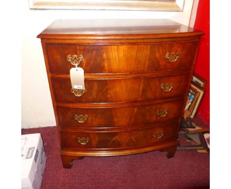 A mahogany bowfronted chest fitted four drawers with brass handles on bracket feet