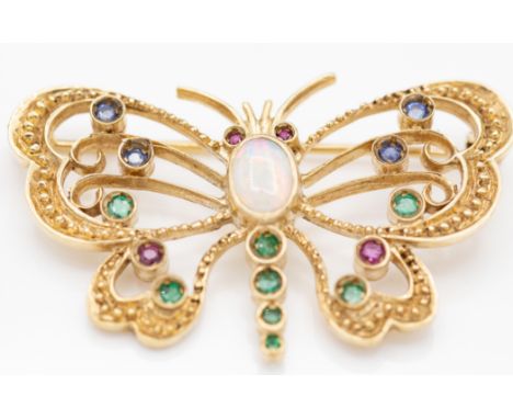 A hallmarked 9ct gold, opal, sapphire, ruby and emerald butterfly brooch. The brooch having pierced decoration to the wings b