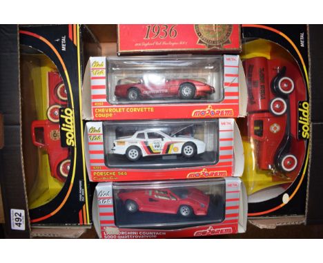 A collection of boxed vintage die cast vehicles to include Solido 8003 and 8005 Fire Engines, Majorette 1/24 scale 4202 Chevr