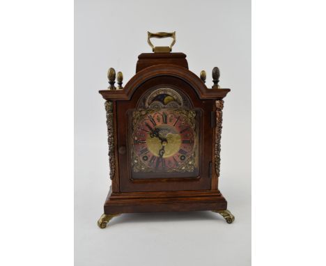 Wuba Warmink mahogany and similar cased mantel clock with metal roman numeral dial, supported on brass feet, 24cm tall, with 