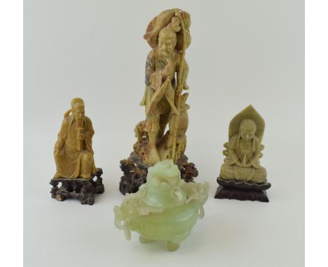 A 20th century jade (or similar) serpentine tripod censer and cover with a trio of carved soapstone figures or traditional fi