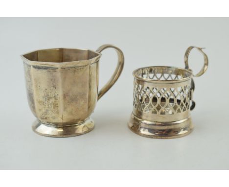 A silver octagonal small tankard, 7cm tall, Birmingham 1928, with a pierced cup holder, Birmingham 1903 (2), 175.7g.  