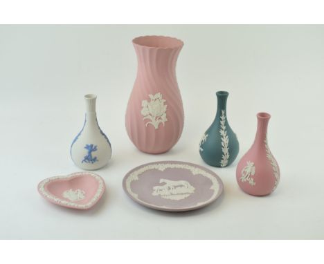 A collection of Wedgwood Jasperware items to include pink vase, pin tray and bud vase, lilac 6 1/2" and teal and cream bud va