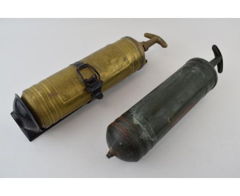 Two brass fire extinguishers by 'Pyrene' made in England. One with original wall mountable bracket. (2) 37cm.  One has been o
