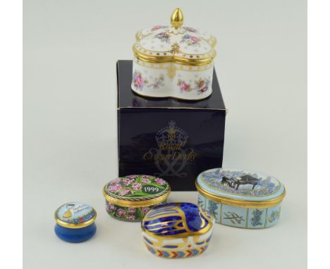 A Royal Crown Derby Royal Antoinette dressing table lidded trinket box, red printed marks on the base, boxed, a Millennium Bu