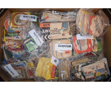 A collection of vintage beer mats divided into categories, 'Bitters', Spirits','Whiskey', 'Ciders' and other similar examples