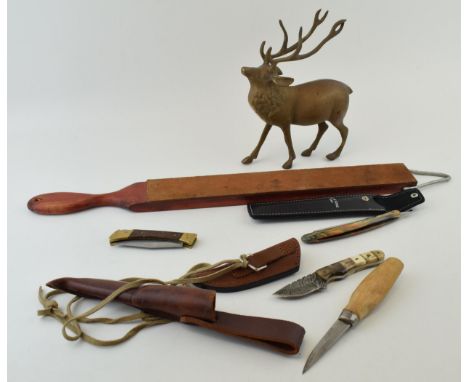 A collection of hunting knives, strop, and 'Creative Edge, London' cut throat razor. (Qty)  