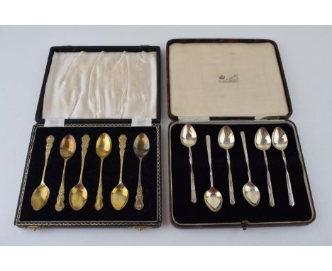 Two cased sets of six silver tea spoons, one gilt set, Birmingham 1957, Henry Clifford Davis, with a similar set, Chester 193