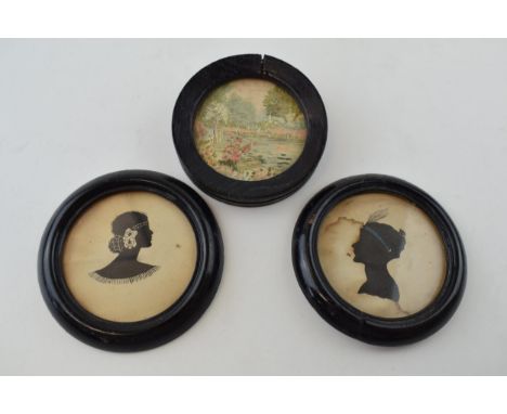 A pair of circular framed silhouettes of two ladies' profiles with a similar small tapestry (3), largest 11cm diameter.  Some