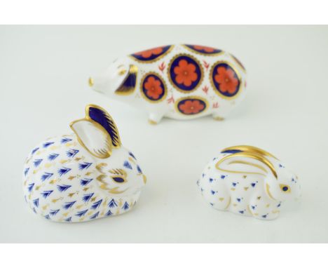 Royal Crown Derby paperweights to include an Imari Pig together with two Rabbits, all first quality (3) Height 7.5cm.  In goo