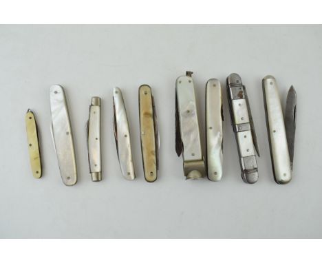 A collection of mother of pearl handled penknives, pipe tempers and pocket knives to include single and double blade examples