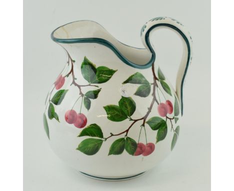 Large Wemyss Ware bulbous jug, decorated with plums and foliage, impressed marks and stamped retailer 'T Goode &amp; Co', 26c