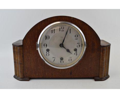 Enfield Mantle clock with Westminster chiming movement. Made in England. With key. Height 22.5cm.  Winds, runs and ticks down