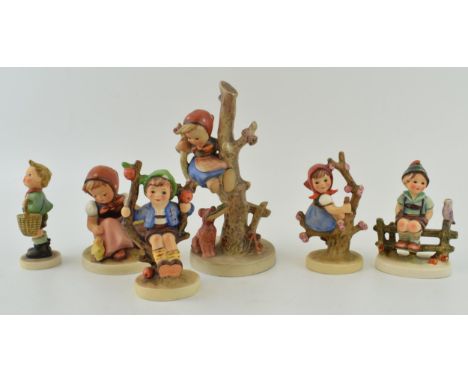 Goebel figures to include a girl in a tree avoiding a dog, boy in apple tree (af), girl in apple tree, boy with bird and othe