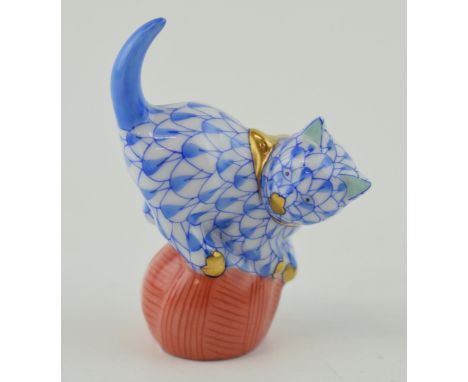 Herend Pottery miniature figure of a Cat playing with a ball, in blue fishnet decoration, 5.5cm tall.  In good condition with