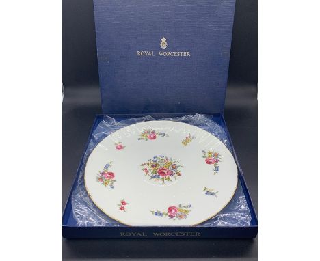 A boxed Royal Worcester floral design plate 