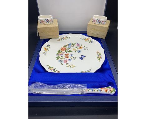 A boxed Hammersley plate and two boxed napkin rings 