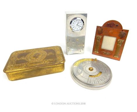 A reproduction Rennie Mackintosh pewter clock together with a WWI chocolate tin, an American copper photograph frame, and a f