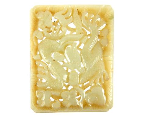 A Chinese, carved jade, rectangular panel/pendant depicting a writhing, scaled dragon amongst swirling clouds within a border
