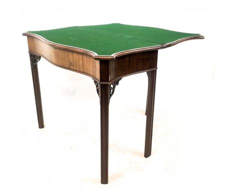 A Georgian mahogany serpentine card table, having Chippendale style pierced detail, 74 x 89 x 43cm.