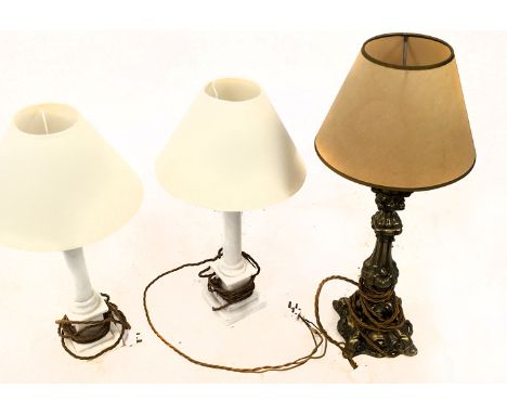 A pair of alabaster table lamps in the form of classical columns, together with a brass Baroque style table lamp.