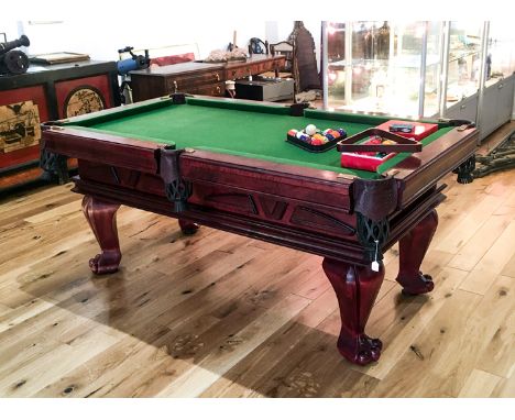 A "Bilijardai" slate bed, pool/snooker table, having leather pockets, raised on chunky cabriole supports terminating in paw f