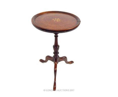 A mahogany and brass inlaid occasional table on three, splayed legs, Height: 50 cm. Dia of tabletop: 29 cm. 