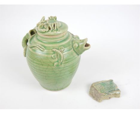 A Chinese celadon glazed teapot, with a crab to the lid, a shark to the body, and a fish head spout, 18 x 17 x 14cm, together