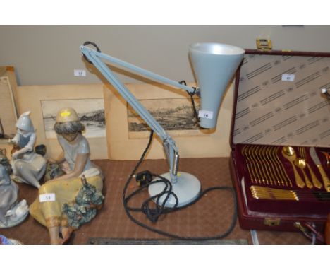 An angle poise style lamp
