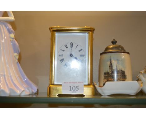 A brass cased striking carriage clock 