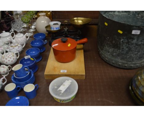 A chopping board; together with a set of scales and weights; and a Le Creuset style cooking pot
