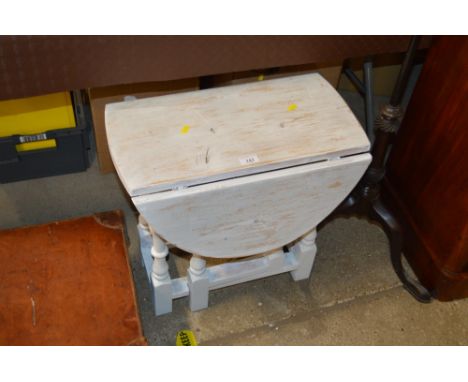 A white painted small drop leaf gate leg table 