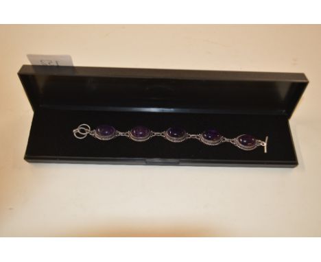 A boxed amethyst and silver bracelet