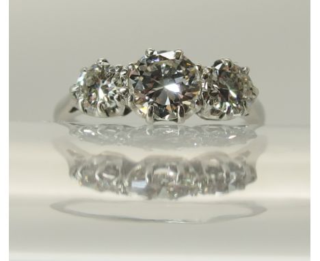 A platinum three stone diamond ring of estimated approx 1ct in total in classic crown mounts. finger size K. Weight 3.1gms