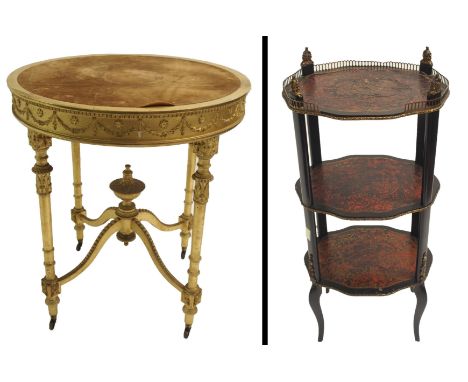 A giltwood circular occasional table with baize top above carved swags on leaf capped tapestry legs joined by an urn stretche