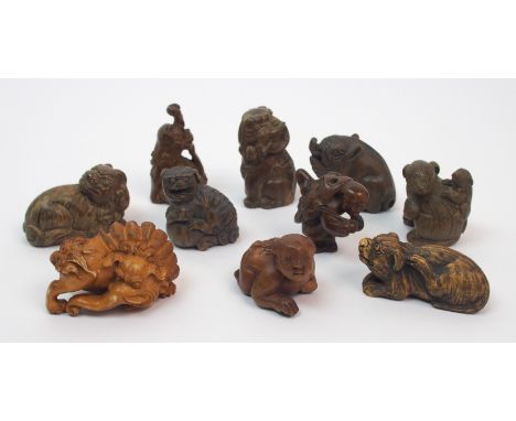 Ten hardwood and stained netsuke carvings comprising; three grotesque animals, 5cm high, three various cubs, 4cm to 5cm wide,