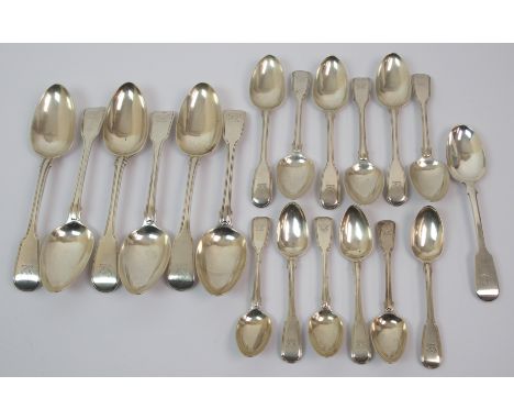A set of six George III silver tablespoons unclear maker's marks, London 1817, fiddle pattern with finial bearing a crest, wi