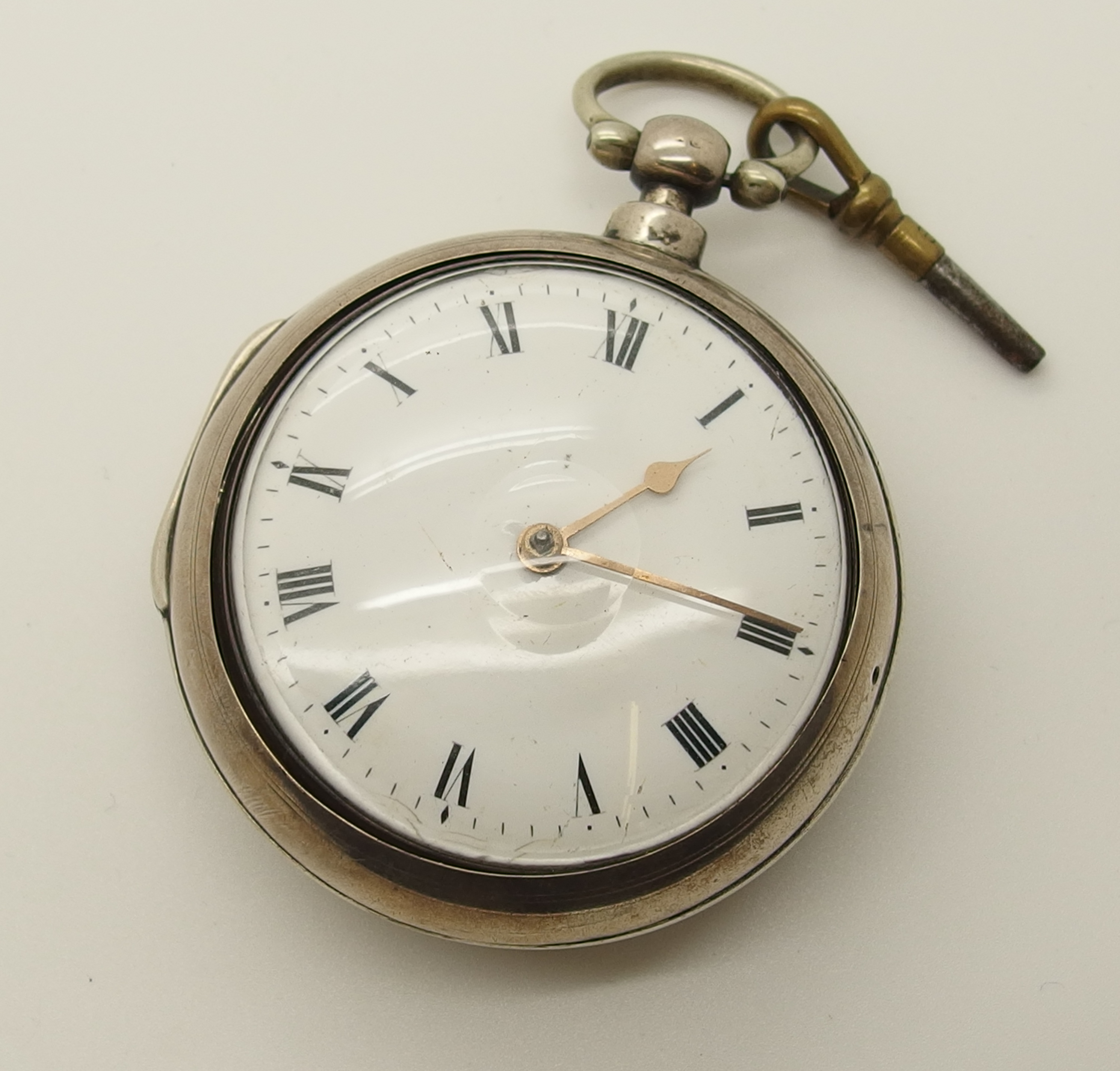 A George IV silver pair cased pocket watch made by Eaton of London with ...