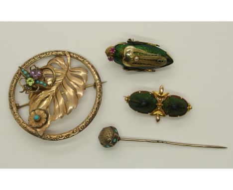 A collection of bug brooches to include a 15ct gold mounted jewel beetle brooch, length 3.5cm, weight 2.8gms. A large jewel b