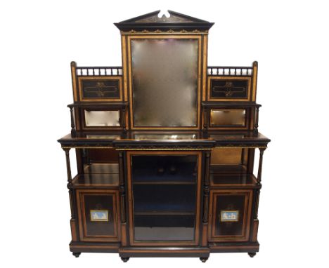 A Victorian ebonised, walnut and gilt metal display cabinet the architectural mirror frame flanked by open shelves and mirror