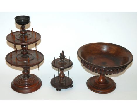A Victorian turned two-tier bobbin holder 36cm high and another smaller example, 20cm high and a Victorian turned tazza, 26cm
