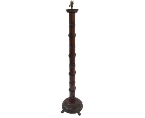 A Chinese hardwood standard lamp with faux bamboo carved column on domed base, 154cm high