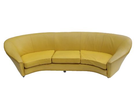 A 1960's yellow leather crescent shaped three seater sofa 73cm high x 264cm wide This item is offered for sale as a work of a