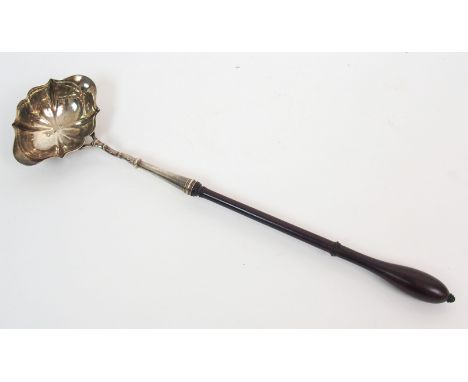 An 18th Century silver bowled toddy ladle maker's marks indistinct, London 1747, with scalloped bowl and turned wooden handle